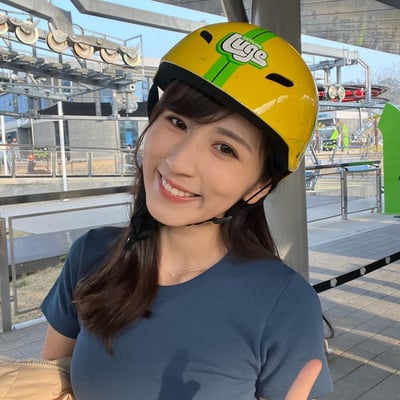 A lady poses for a photo waiting in line ready to ride the Busan Luge.