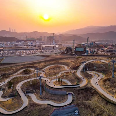 A drone photo of the Skyline Luge Busan site at sunset.