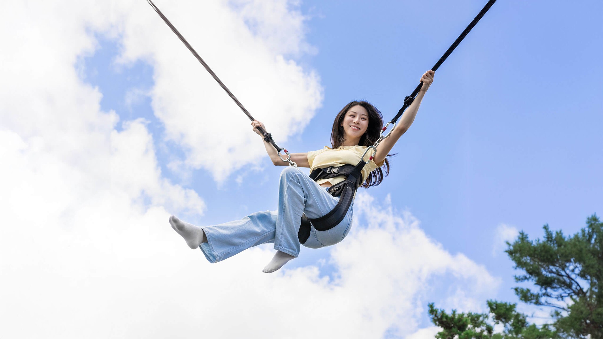 Woman enjoying Eurobungy trampoline jump at Skyline Luge Busan