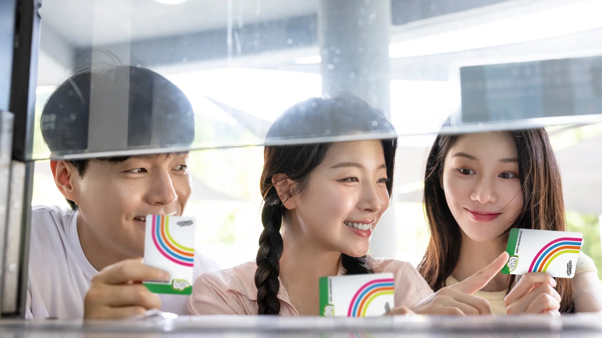 Guests purchasing Skyline Luge Tongyeong membership cards at the counter.